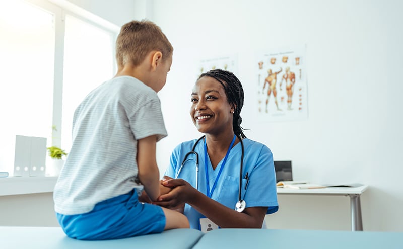 Doctor Comforting Child