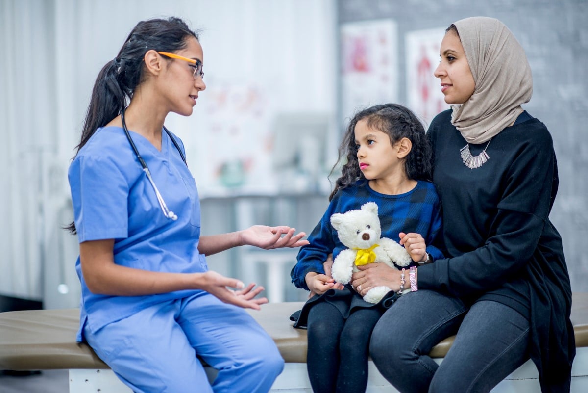 Doctor with mom and daughter.jpg