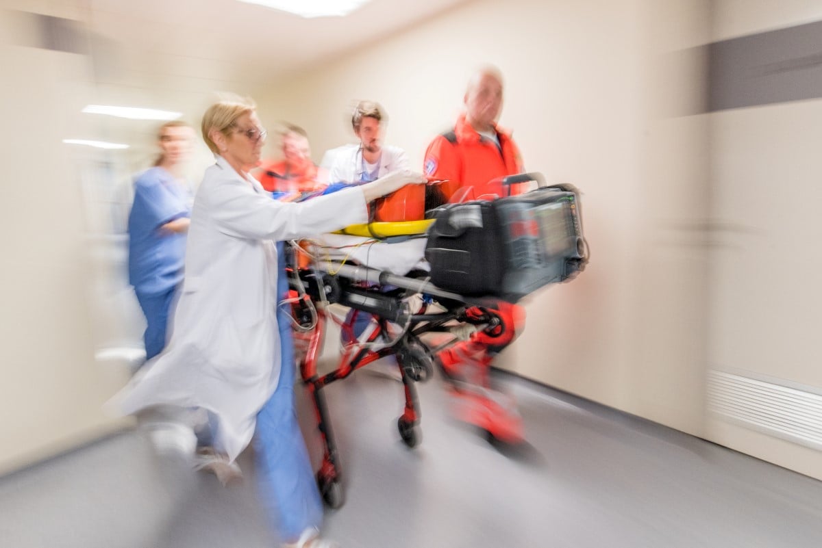 Doctors with patient on stretcher.jpg